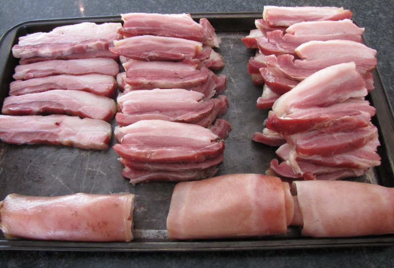 Strip of bacon with the rolled skin in front