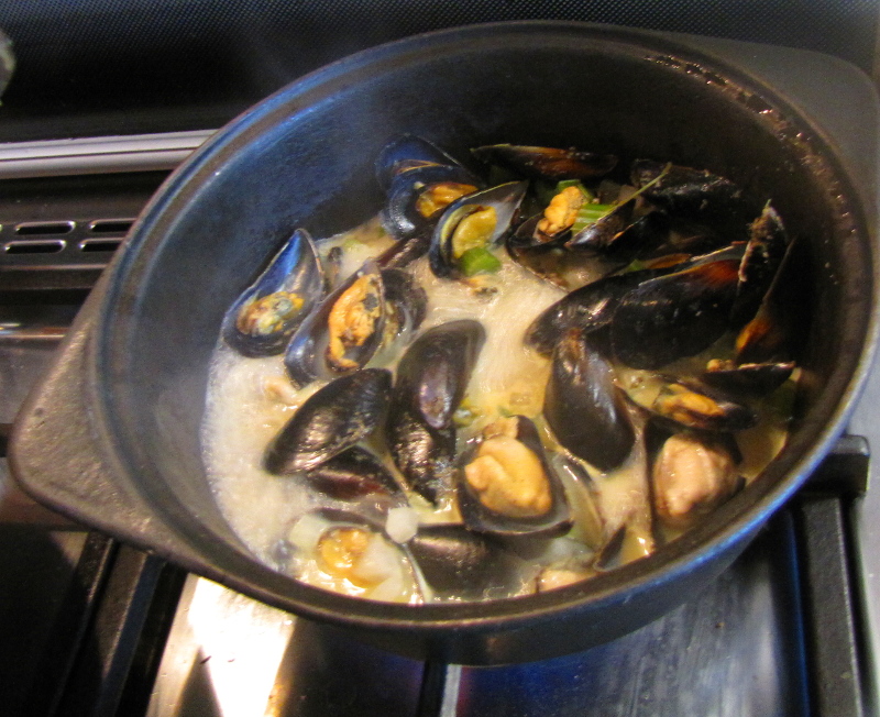 Mussels steaming in a white wine sauce